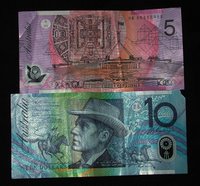 This picture shows the back of the $5 bill and the front of the $10 bill.