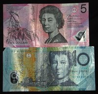 These the Australian $5 and $10 bills. Note the differences in size and color, and note also that Australian paper notes have a clear plastic window in the corner of the bill. This is the front of the $5 bill and the back of the $10 bill.
