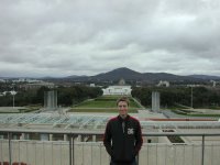 Me on the roof of parliament house. You can see straight down to the war memorial in the background. The hill behind me is Mount Ainsle.