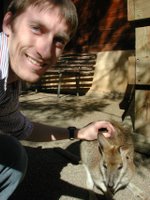 Me petting some sort of little wallaby thing.