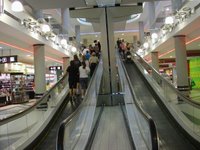A genius idea: ramped escalators! Aussies use these so that shopping carts can go upstairs in malls, but also so that carts can take your luggage upstairs in airports! USA: think about it! :) 