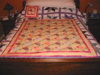 Maya's quilt, on top of my quilt