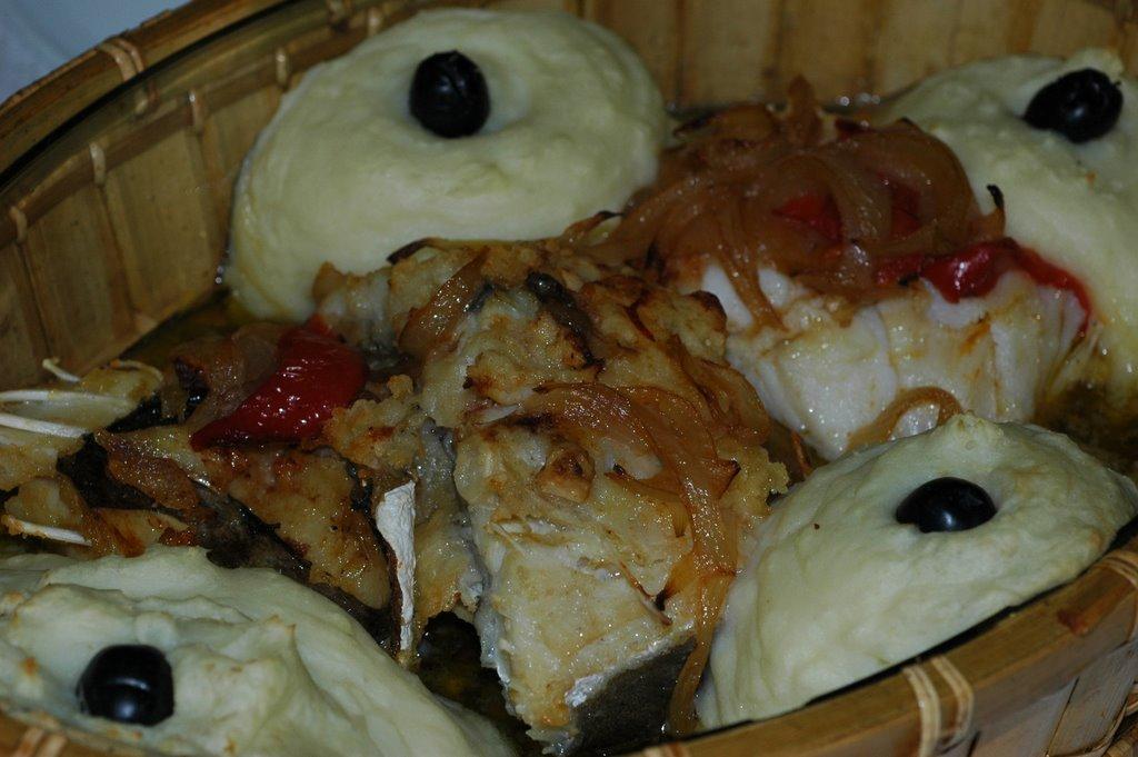 Portuguese bachalau and mashed potato with onion, peppers and olives