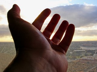 hand reaching towards the sky