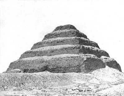 Largely covered in sand, Djoser's step pyramid.