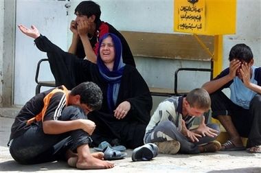 Mother and children mourning Wisam Ali, 13, who was killed on the way to the Imam Moussa Kadhim shrine