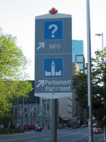 sign pointing to Parliament