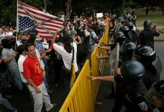 Costa Ricans attend a demonstration against CAFTA and the new Costa Rican President Oscar Arias on Monday May 8, 2006 in San Jose, Costa Rica near the National Stadium where President Oscar Arias is holding his inauguration ceremony. (AP Photo/Cristobal Herrera)