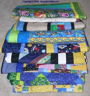 stack of 9 quilts