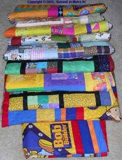 stack of 10 quilts