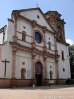 Lupita in front of the door to la Basilica de Nuestra Señora de la Salud