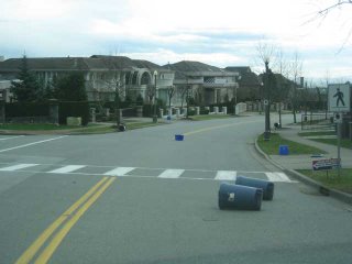Trashcans littering the road.