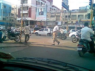 We have heard of barefoot doctors, but here you see a chappal wearing cop with a crumpled uniform and a lazy gait
