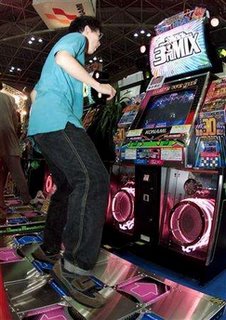 A teenager is seen using the Dance Dance Revolution video game in Tokyo.