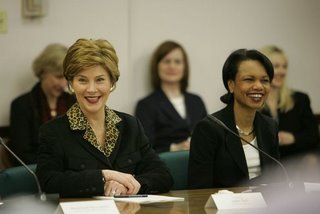 First Lady Laura Bush and Secretary of State Condoleeza Rice aim their phasers at wide-ranging targets during a panel discussion.