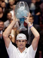 Andy Roddick hoisting the trophy for Lyon