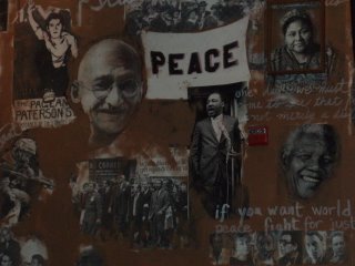 busboys and poets wall painting of Ghandi and King and other heroic peaceful leaders