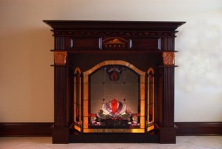 Intarsia design inset on fireplace mantel.