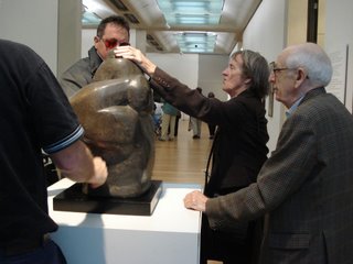 Elaine touching the woman and child sculpture