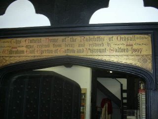 The inscription over the top of the hudge door in the grand hall: 'This Ancient Home of the Radcliffes of Ordsall was rescued from decay and restored by Wilbraham Earl Egerton of Tatton and Viscount Salford. 1897'