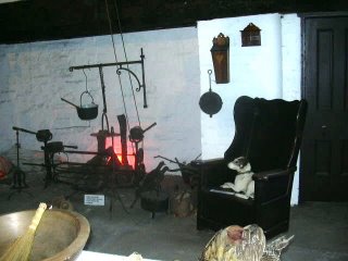 A large fireplace in the kitchen