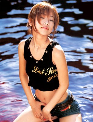 gorgeaous asian supermodel posing on water