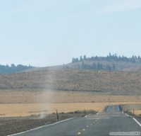 Douglas County dust devil crossing the road
