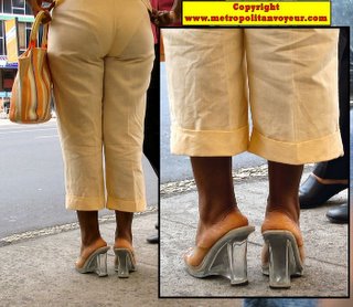 Transparent plastic wedge high heels of sexy black woman