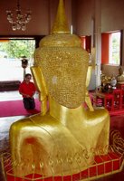 The Phra Phut image and man praying