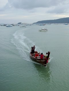 Longtail boat coming in to Chalong jetty