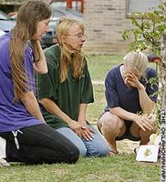 Members of Jamie Bolin's family grieve Saturday near the apartment where she lived.
