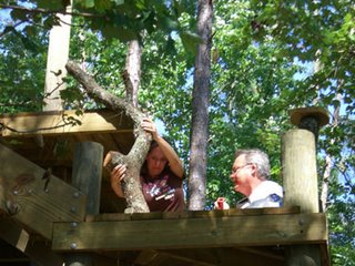 Stephaney & her Dad, Royce, put a rail post into place.