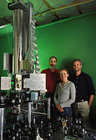 NIST researchers (left to right) Steven Jefferts, Elizabeth Donley, and Tom Heavner with NIST F1, the world's best clock (as of Sept. 2005). The clock uses a fountain-like movement of cesium atoms to determine the length of the second so accurately that—if it were to run continuously—it would neither lose nor gain one second in 60 million years. © 05 Geoffrey Wheeler Photography