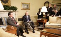 President George W. Bush listens as King Abdullah of Jordan makes remarks Wednesday, Feb. 8, 2006, during a photo opportunity in the Oval Office. The two leaders took the opportunity to urge an end to recent violence over caricatures of the Prophet Mohammed. White House photo by Eric Draper.
