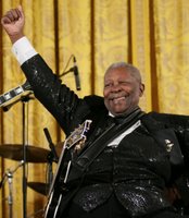 Legendary Blues guitarist B.B. King gestures at the end of his performance in the East Room of the White House Monday, June 26, 2006, as part of the Black Music Month celebration focusing on the music of the Gulf Coast: Blues, Jazz and Soul. White House photo by Eric Draper.