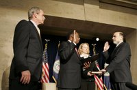 President George W. Bush participates in the swearing-in ceremony Monday, Feb. 6, 2006, for Ben Bernanke as Chairman of the Federal Reserve. Vice Chairman Roger W. Ferguson, Jr., administers the oath of office to Chairman as Mrs. Anna Bernanke, the Chairman's wife, holds the Bible. White House photo by Kimberlee Hewitt.