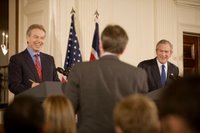 President George W. Bush and British Prime Minister Tony Blair participate in a joint news conference Thursday evening May 25, 2006 in the East Room of the White House, where the two leaders vowed their support to the new government of Iraq. White House photo by Eric Draper.
