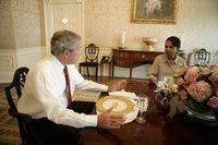 President George W. Bush meets with U.S. Secretary of State Condoleezza Rice at the White House Monday evening, July 31, 2006, to discuss her recent trip to the Middle East. White House photo by Eric Draper.