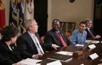 President George W. Bush meets with Darfur advocates, including former slave Simon Deng, in the Roosevelt Room Friday, April 28, 2006. 'I just had an extraordinary conversation with fellow citizens from different faiths, all of who have come to urge our government to continue to focus on saving lives in Sudan,' said the President to the press. 'They agree with thousands of our citizens -- hundreds of thousands of our citizens -- that genocide in Sudan is unacceptable.' White House photo by Paul Morse.