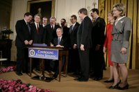 President George W. Bush is joined by legislators Wednesday, Feb. 8, 2006 at the signing ceremony for S. 1932, The Deficit Reduction Act of 2005, in the East Room of the White House. White House photo by Eric Draper.