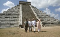 President George W. Bush is flanked by Canada's Prime Minister Stephen Harper, left, and Mexico's President Vicente Fox as they tour the Chichen-Itza Archaeological Ruins Thursday, March 30, 2006, with Dr. Federica Sodi, Regional Director of National Institute of Anthropology and History. White House photo by Eric Draper.