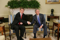 President George W. Bush and Prime Minister Ferenc Gyurcsany of Hungary shake hands during a photo opportunity in the Oval Office of the White House Friday, Oct. 7, 2005. The President told the media he appreciated the Prime Minister's understanding of the 