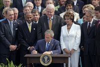 President George W. Bush signs H.R. 9, the Fannie Lou Hamer, Rosa Parks, and Coretta Scott King Voting Rights Act Reauthorization and Amendments Act of 2006, on the South Lawn Thursday, July 27, 2006. White House photo by Paul Morse.