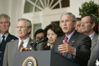 President George W. Bush stands with Secretary of Defense Donald Rumsfeld; Secretary of Labor Elaine Chao and Mike Leavitt, Secretary of Health and Human Services, as he speaks to the media from the Rose Garden of the White House regarding the devastation along the Gulf Coast caused by Hurricane Katrina. White House photo by Paul Morse