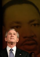 President George W. Bush looks up at the audience while taking the stage before his remarks at Georgetown University's 'Let Freedom Ring' Celebration Honoring Dr. Martin Luther King at the John F. Kennedy Center for the Performing Arts, Monday, Jan. 16, 2006. White House photo by Eric Draper.