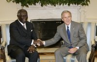 President George W. Bush welcomes Ghana President John A. Kufuor to the Oval Office at the White House, Wednesday, Oct. 26, 2005. President Kufuor arrived in Washington this week to promote trade, investment and tourism in Ghana. White House photo by Eric Draper