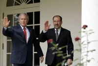 President George W. Bush and Iraqi Prime Minister Nouri al-Maliki walk along the colonnade of the Rose Garden after meeting in the Oval Office Tuesday, July 25, 2006. White House photo by Paul Morse.