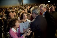 Audience members greet and hug President George W. Bush after his talk about the Medicare prescription drug benefits at the Richard J. Ernst Community Center at Northern Virginia Community College in Annandale, Va., Wednesday, April 12, 2006. President Bush urged senior citizens to participate in the new Medicare program to reduce their drug costs. White House photo by Kimberlee Hewitt.