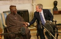 President George W. Bush welcomes Nigerian President Olesegun Obasanjo to the Oval Office Wednesday, March 29, 2006. White House photo by Shealah Craighead.