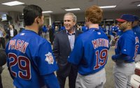 President George W. Bush talks with Cubs outfielders Angel Pagan, left, and Matt Murton before the opening game between the Cincinnati Reds and the Chicago Cubs in Cincinnati, Ohio, Monday, April 3, 2006. White House photo by Eric Draper.